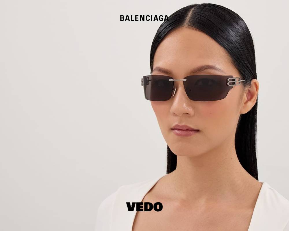 Balenciaga BB 0485S Wraparound Rimless vedo Sunglasses silver black